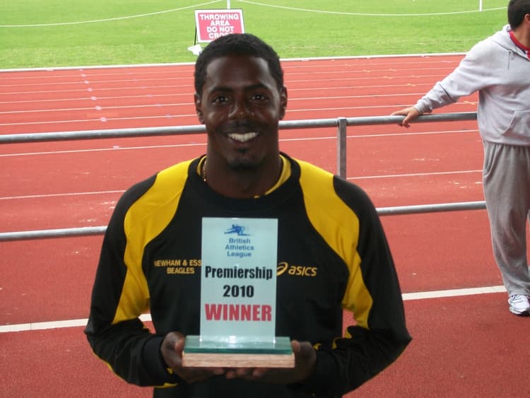 Andre holding the British Athletics League Premiership 2010 winner's trophy