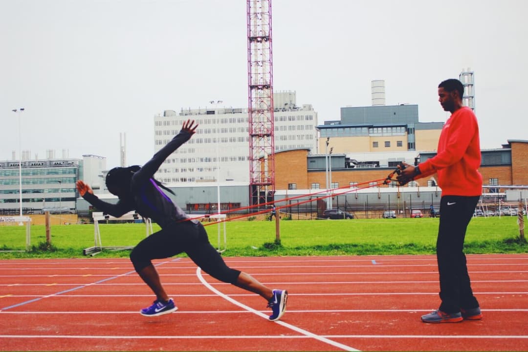 Andre coaching resisted acceleration drills on the track